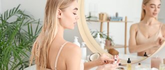 Girl in the bathroom using facial product
