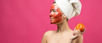 Beauty portrait of a woman in a white towel on her head with a red nourishing mask